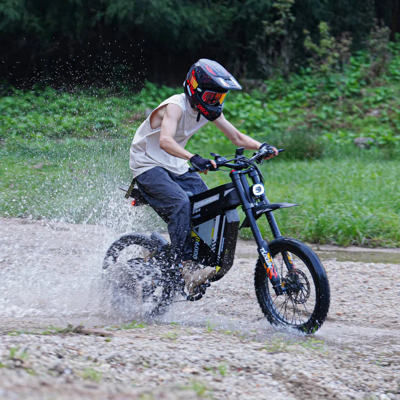 COSWHEEL R6000 riding through water on a gravel trail